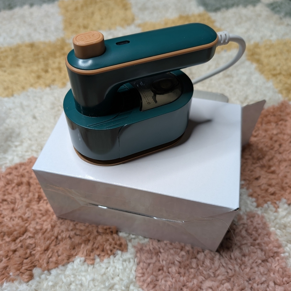 Compact Teal and Orange Travel Iron